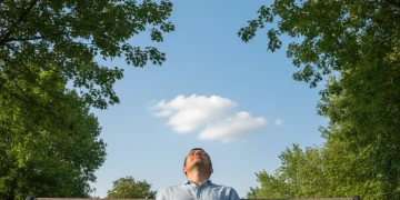 Person enjoying nature during a digital detox challenge